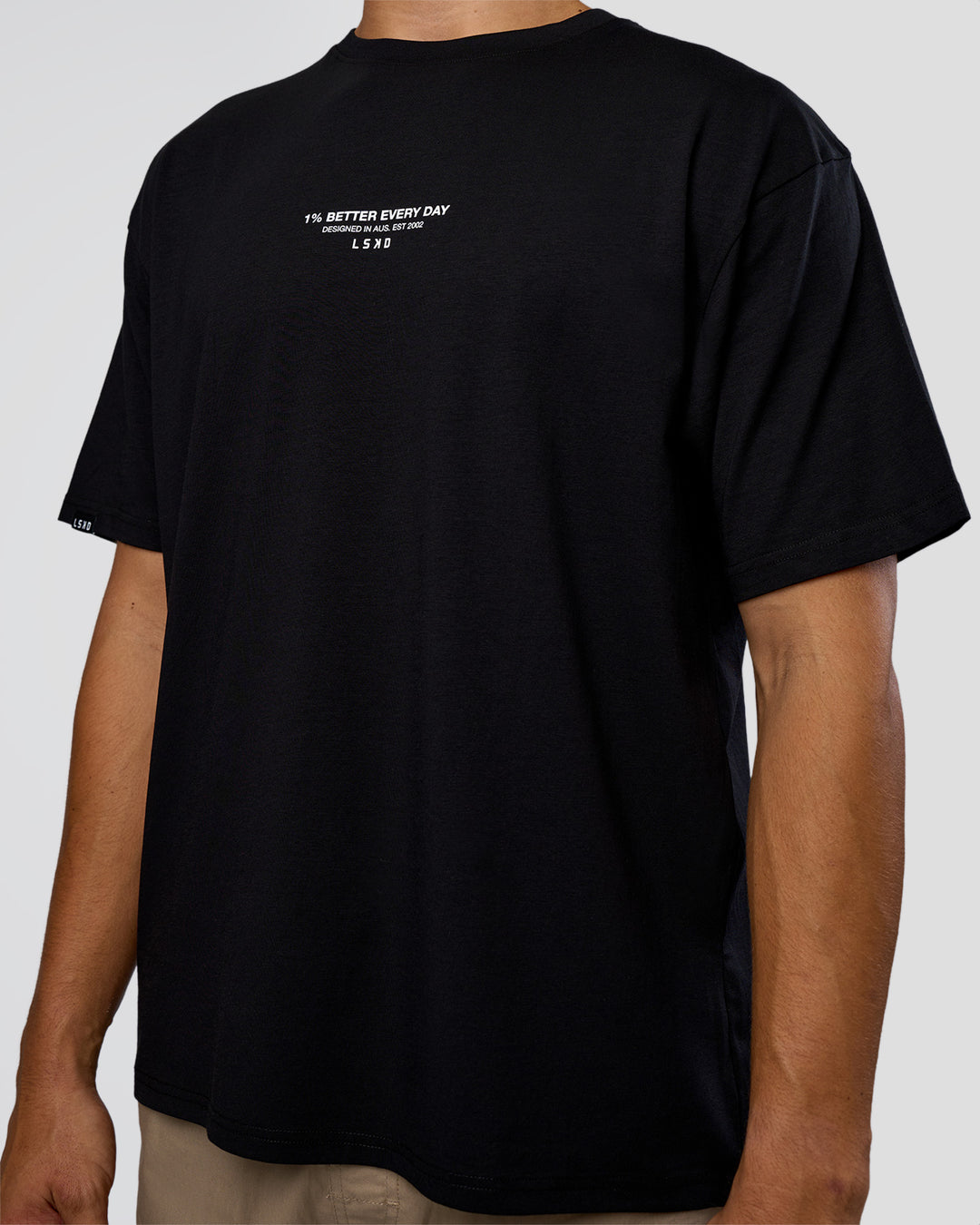 Man wearing 1% Better Every Day EST FLXCotton Oversized Tee - Black | Model:Jackson | Size:L - view 8