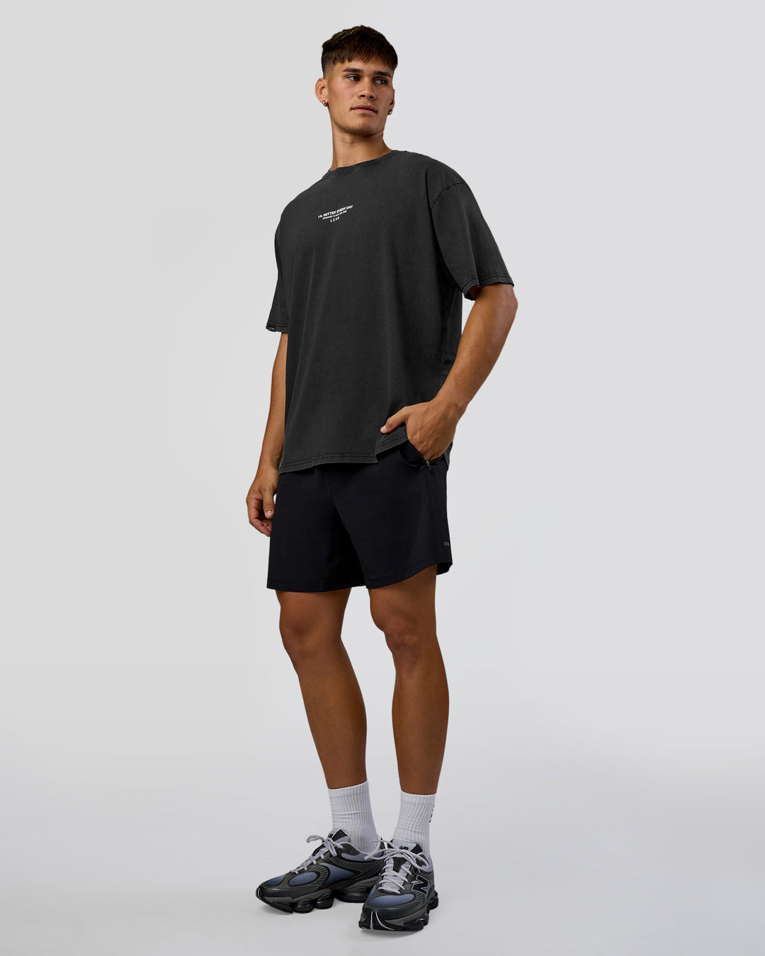 Man wearing 1% Better Every Day EST FLXCotton Oversized Tee - Black Washed | Model:Jackson | Size:L - view 3