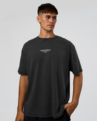 Man wearing 1% Better Every Day EST FLXCotton Oversized Tee - Black Washed | Model:Jackson | Size:L | Thumbnail Index: 1