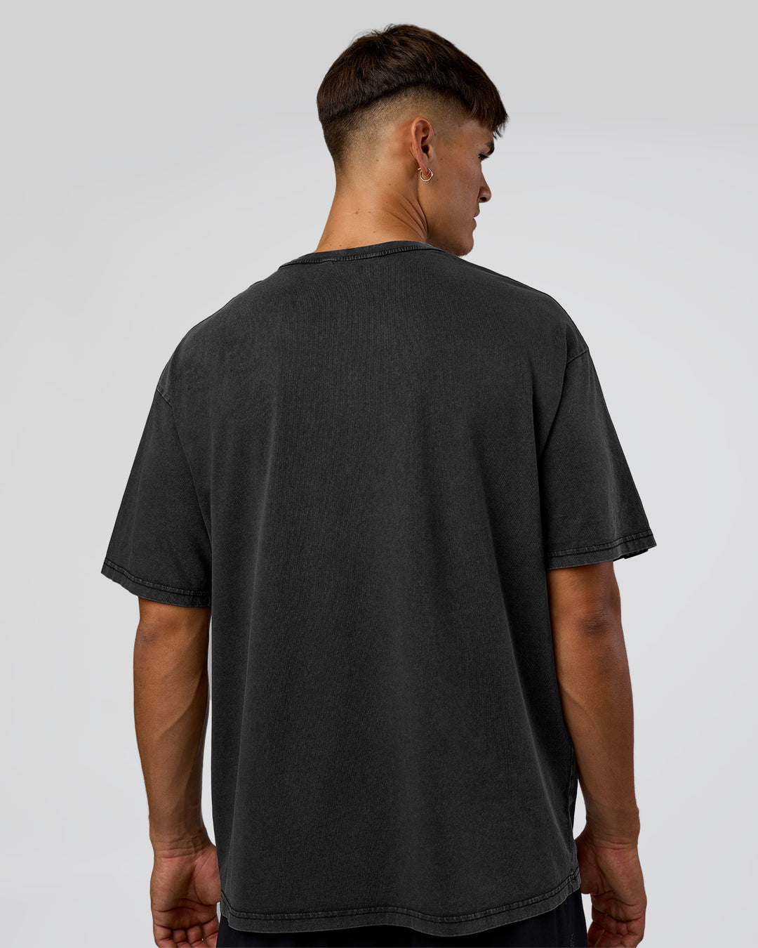 Man wearing 1% Better Every Day EST FLXCotton Oversized Tee - Black Washed | Model:Jackson | Size:L - view 6