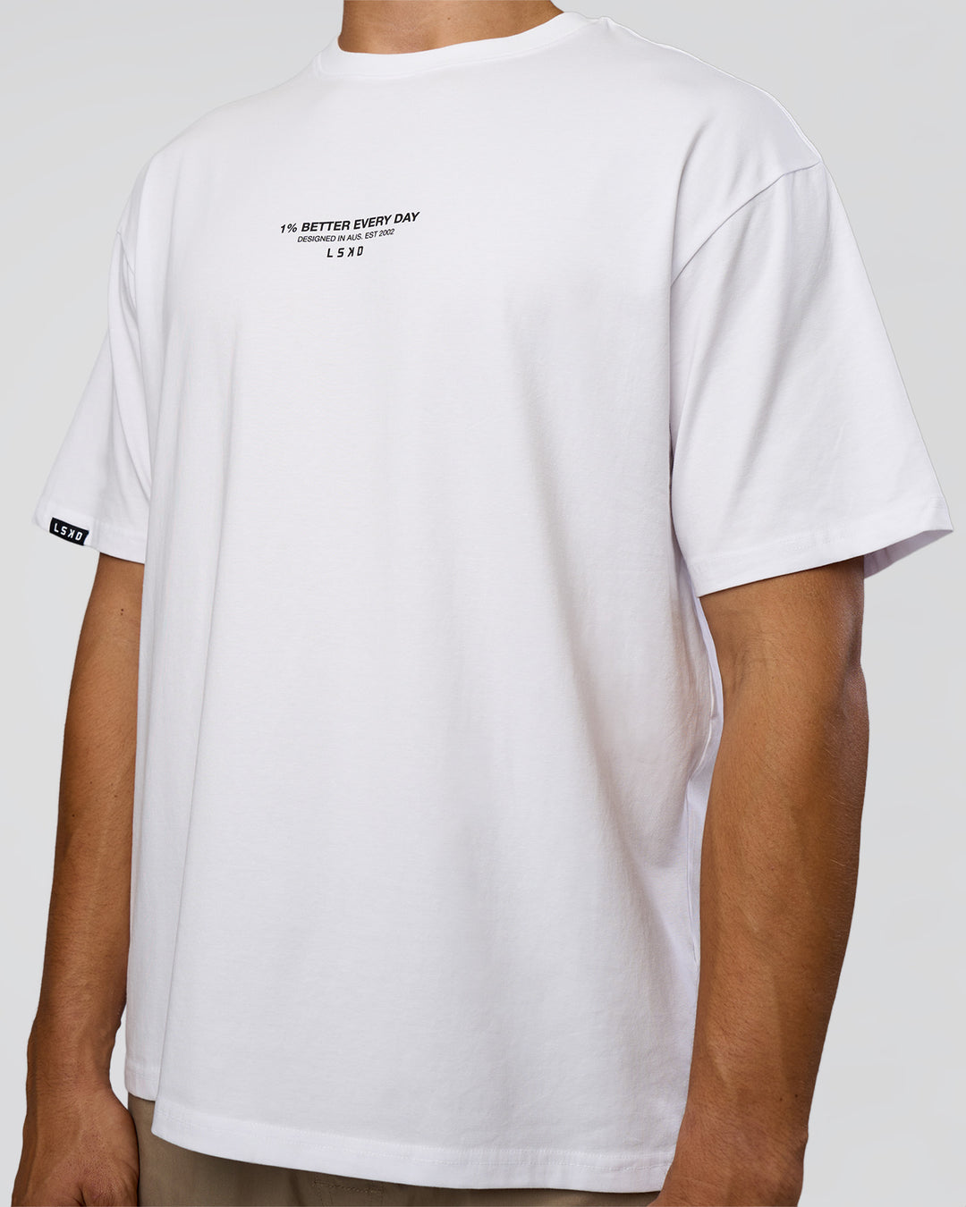 Man wearing 1% Better Every Day EST FLXCotton Oversized Tee - White | Model:Jackson | Size:L - view 8