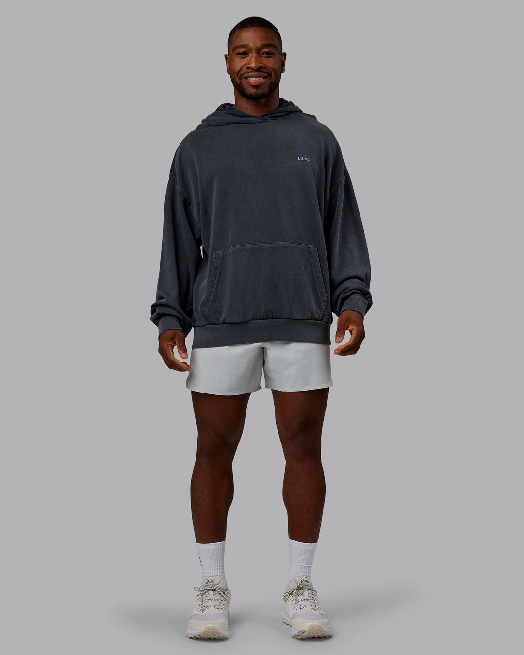 Man wearing 1% Better Value Series Oversized Hoodie - Black-Violet Ray | Model:Sam | Size:L - view 11