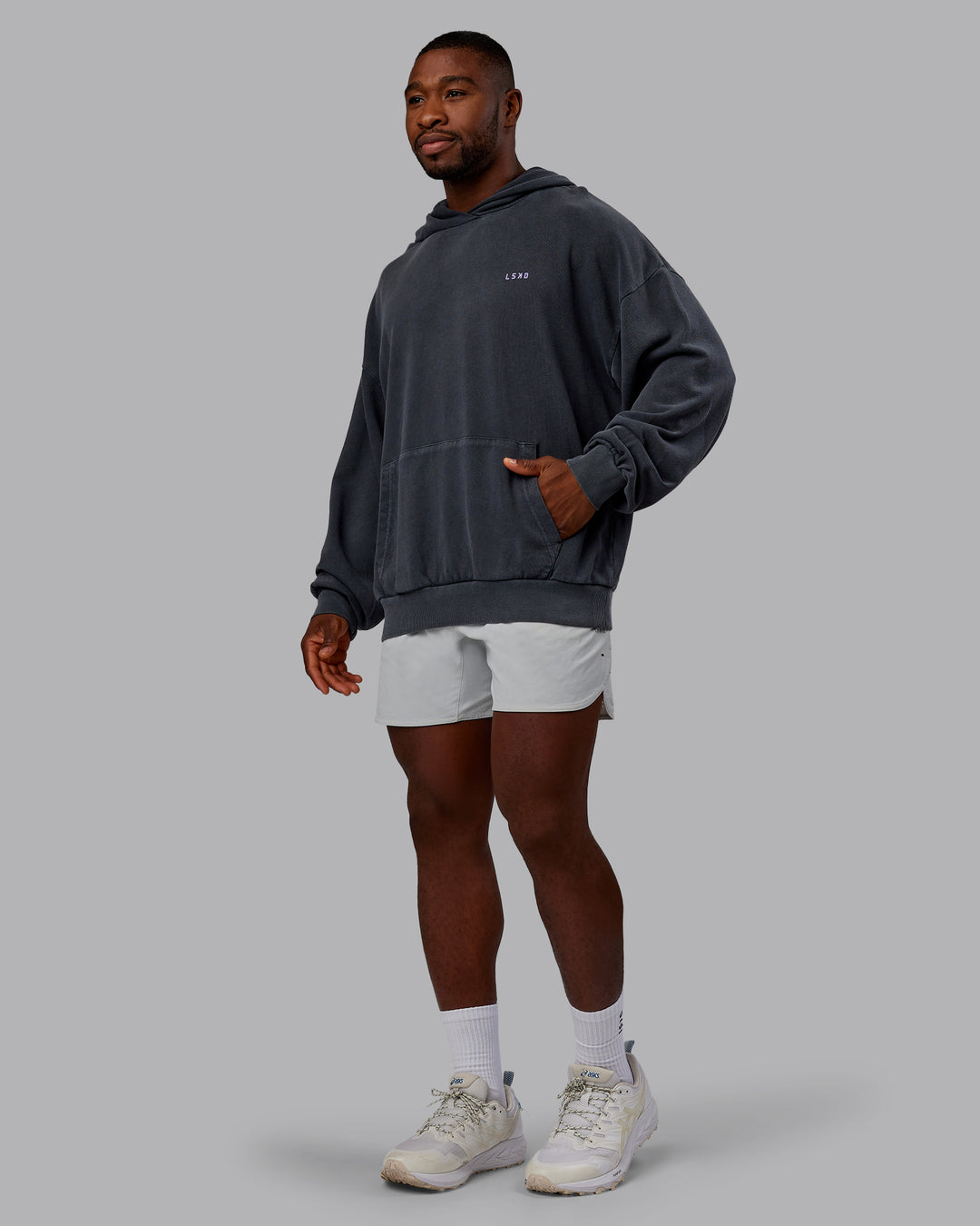 Man wearing 1% Better Value Series Oversized Hoodie - Black-Violet Ray | Model:Sam | Size:L - view 5