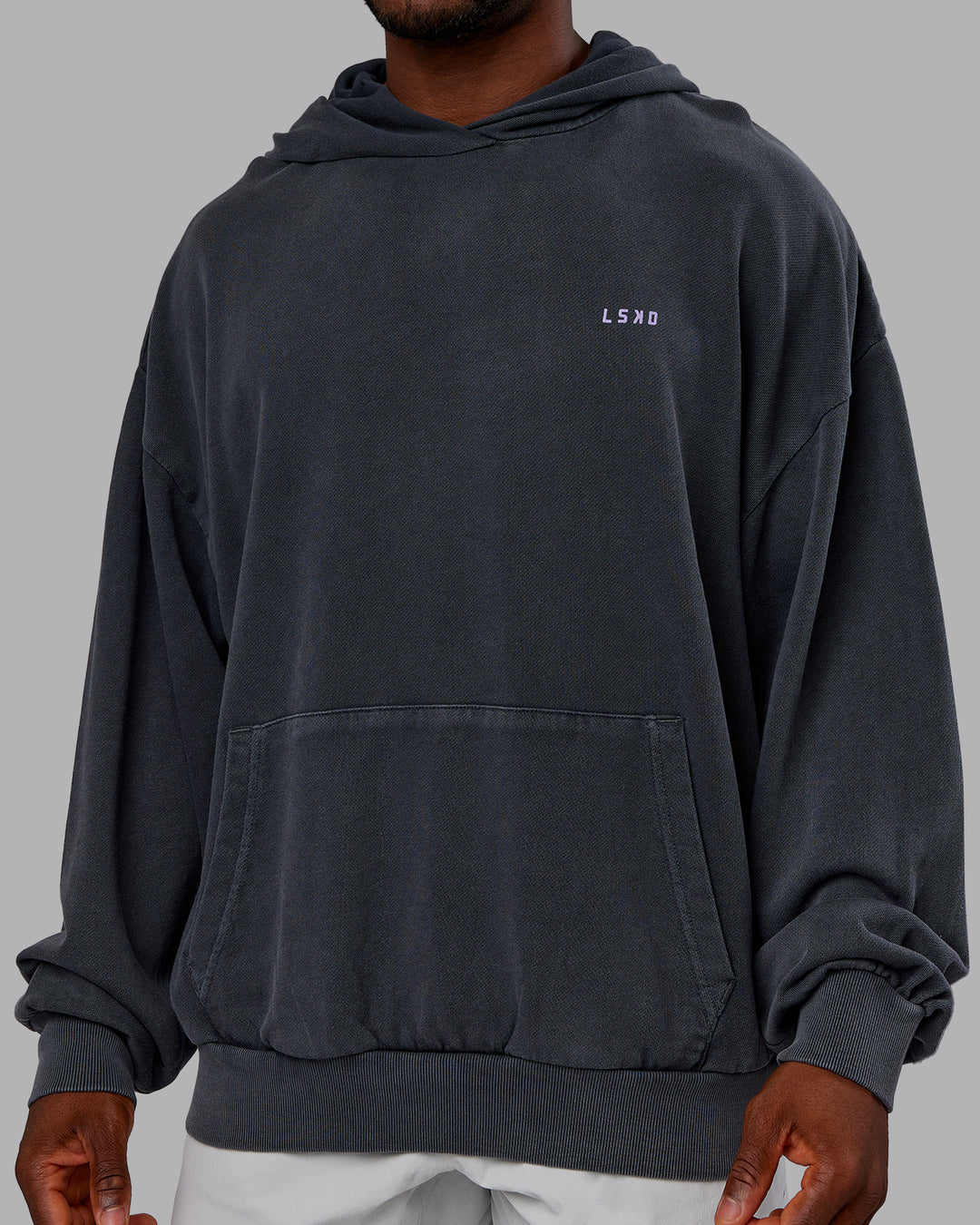 Man wearing 1% Better Value Series Oversized Hoodie - Black-Violet Ray | Model:Sam | Size:L - view 8