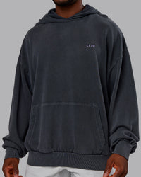 Man wearing 1% Better Value Series Oversized Hoodie - Black-Violet Ray | Model:Sam | Size:L | Thumbnail Index: 7