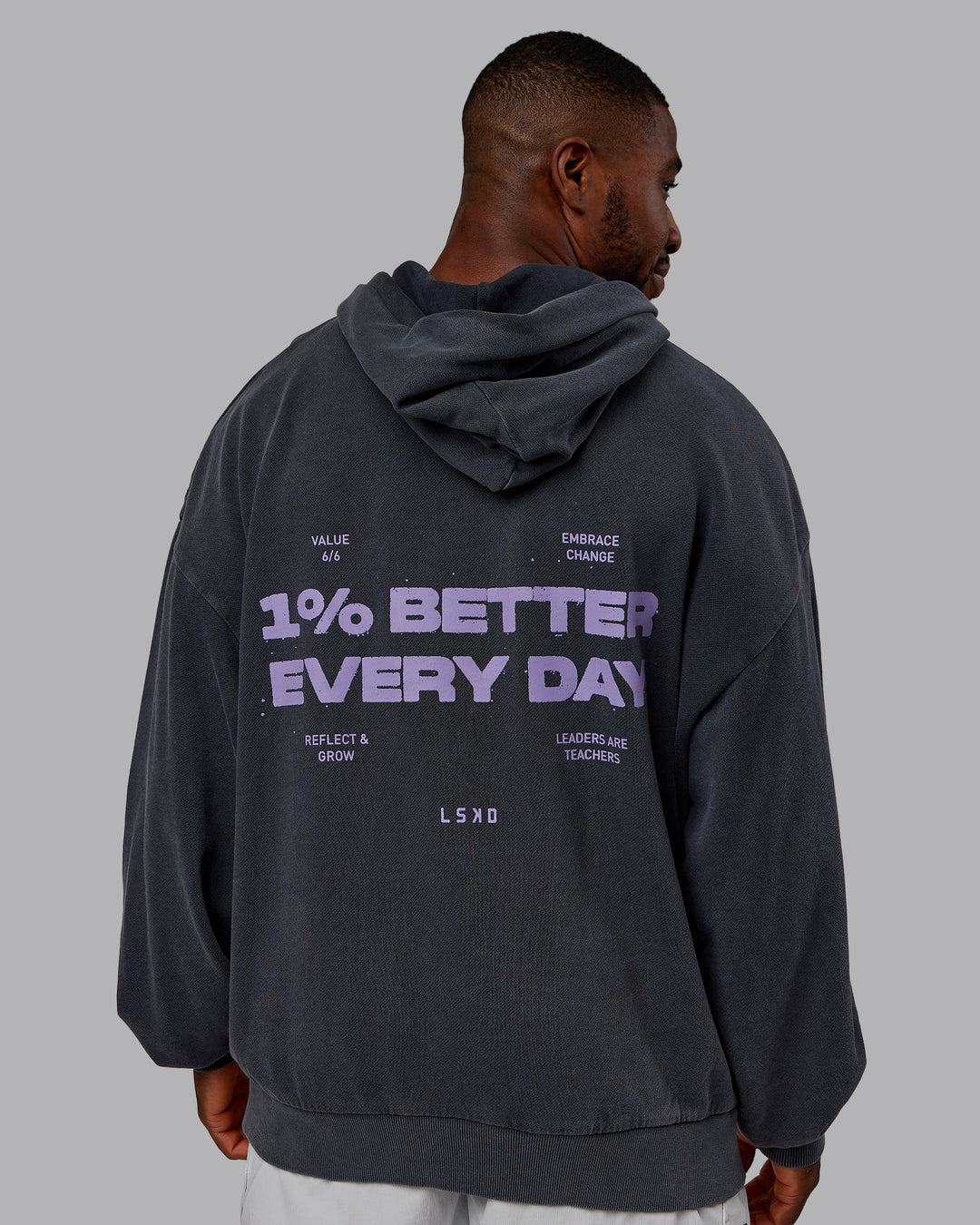 Man wearing 1% Better Value Series Oversized Hoodie - Black-Violet Ray | Model:Sam | Size:L - view 7