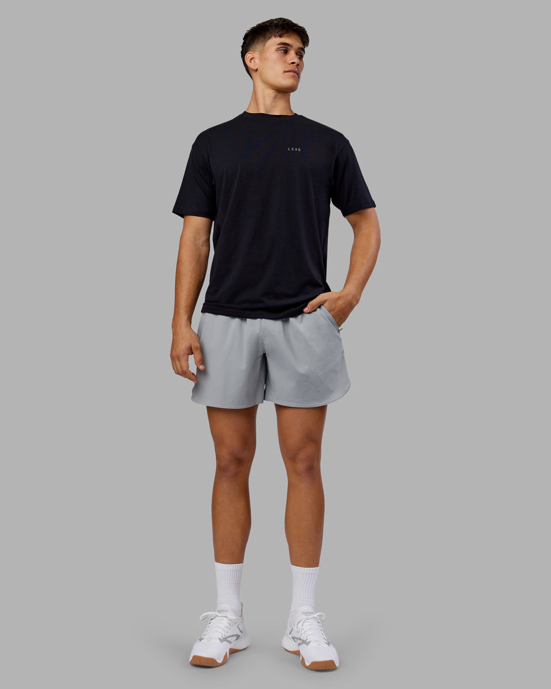 Man wearing 1% Better Value Series FLXCotton Tee Oversize - Black-Black | Model:Jackson | Size:L - view 5