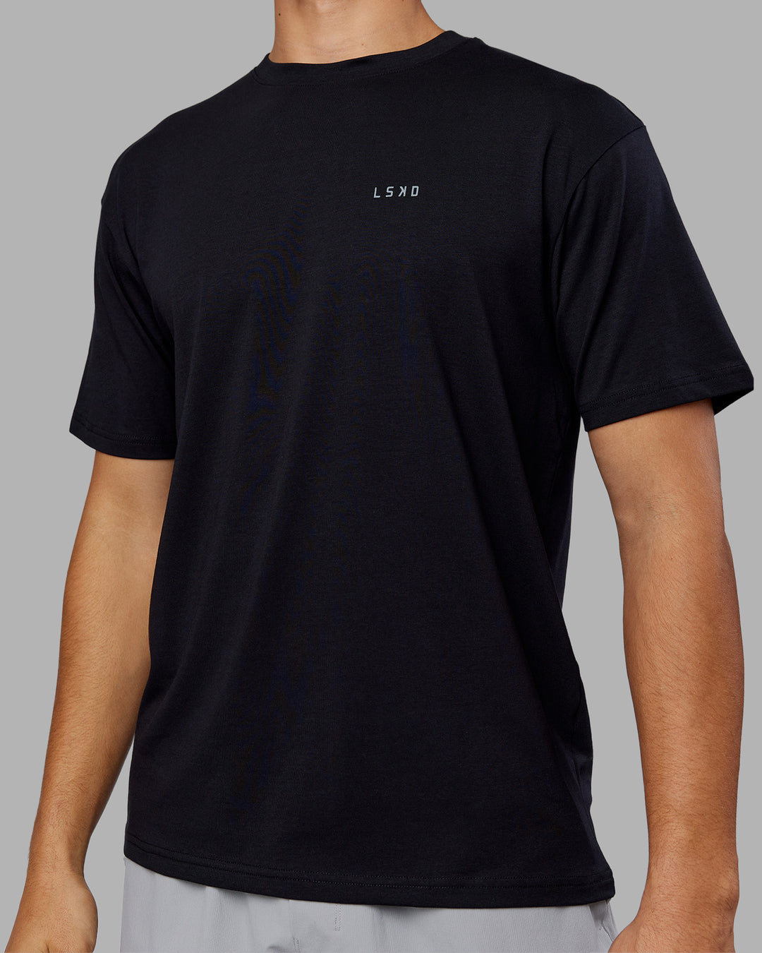Man wearing 1% Better Value Series FLXCotton Tee Oversize - Black-Black | Model:Jackson | Size:L - view 7