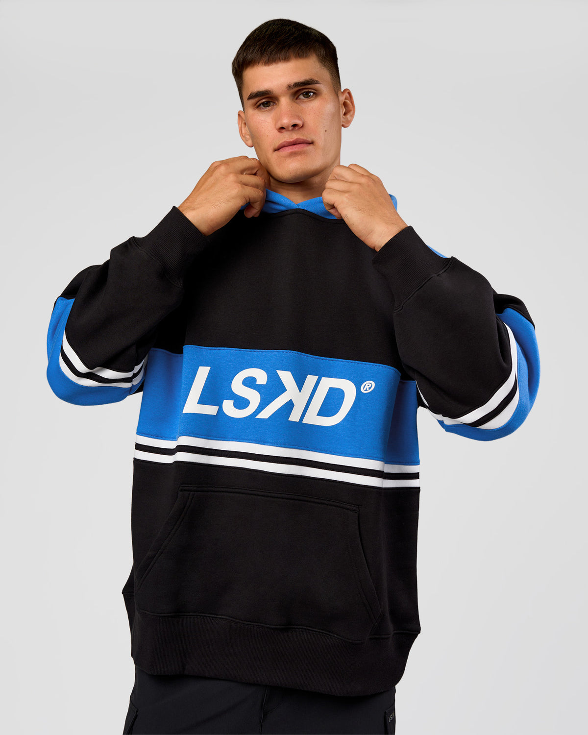 Man wearing A-Team Oversized Hoodie - Caviar-Palace Blue | Model:Jackson | Size:L