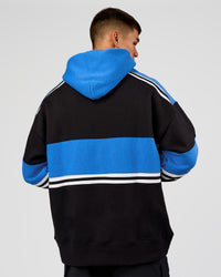 Man wearing A-Team Oversized Hoodie - Caviar-Palace Blue | Model:Jackson | Size:L | Thumbnail Index: 5