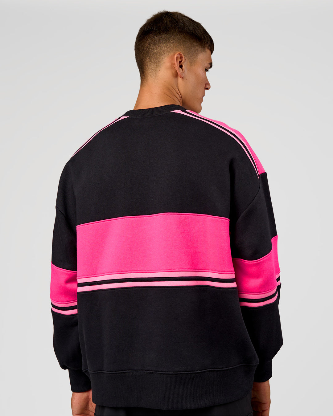 Man wearing A-Team Sweater Oversize - Caviar-Ultra Pink-Candy Pink | Model:Jackson | Size:L - view 8