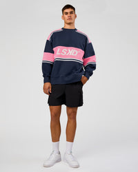 Man wearing A-Team Sweater Oversize - Future Navy-Candy Pink | Model:Jackson | Size:L | Thumbnail Index: 2