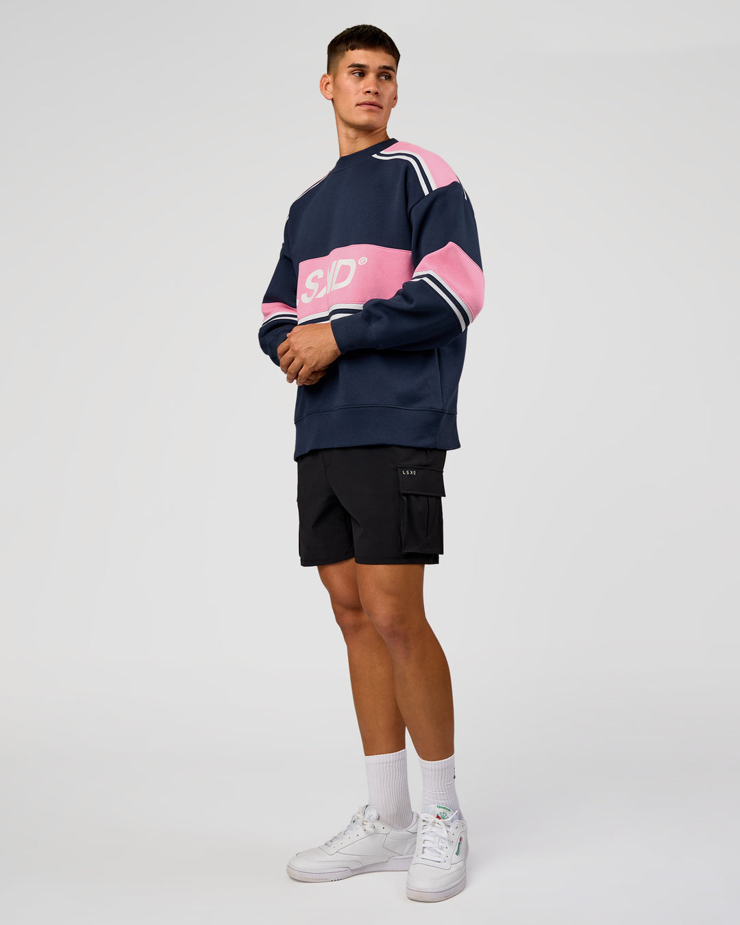 Man wearing A-Team Sweater Oversize - Future Navy-Candy Pink | Model:Jackson | Size:L - view 7