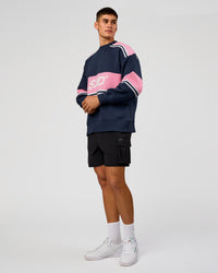 Man wearing A-Team Sweater Oversize - Future Navy-Candy Pink | Model:Jackson | Size:L | Thumbnail Index: 6