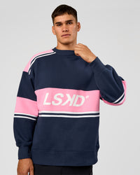 Man wearing A-Team Sweater Oversize - Future Navy-Candy Pink | Model:Jackson | Size:L | Thumbnail Index: 1