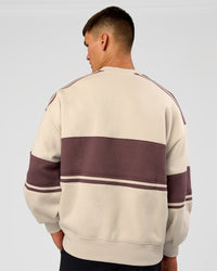 Man wearing A-Team Sweater Oversize - Shale Beige-Cocoa Powder | Model:Jackson | Size:L | Thumbnail Index: 3