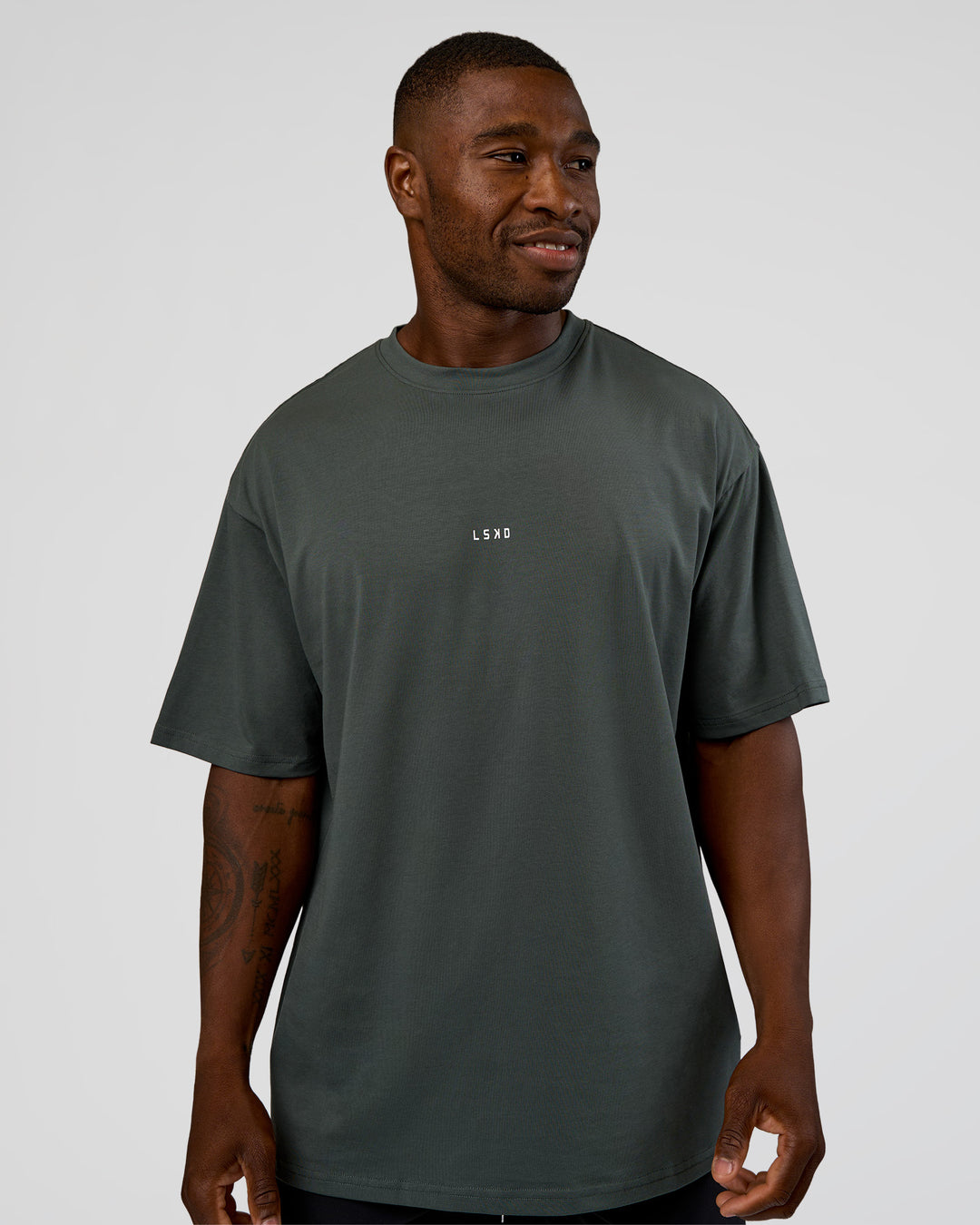 Man wearing Abstract Haze FLXCotton Tee - Carbon Green-Cantaloupe | Model:Sam | Size:L - view 6