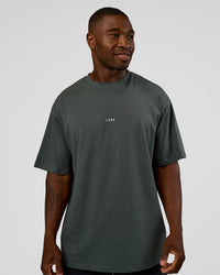 Man wearing Abstract Haze FLXCotton Tee - Carbon Green-Cantaloupe | Model:Sam | Size:L | Thumbnail Index: 5