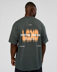 Man wearing Abstract Haze FLXCotton Tee - Carbon Green-Cantaloupe | Model:Sam | Size:L | Thumbnail Index: 1
