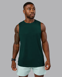 Man wearing AeroFLX+ Seamless Muscle Tank - Dark Moss/Dark Moss Marl | Model:Sam | Size:L | Thumbnail Index: 1