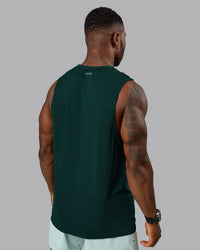 Man wearing AeroFLX+ Seamless Muscle Tank - Dark Moss/Dark Moss Marl | Model:Sam | Size:L | Thumbnail Index: 2