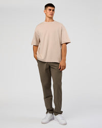 Man wearing AfterDark ZeroCrease Oversized Tee - Shale Beige | Model:Jackson | Size:L | Thumbnail Index: 9