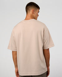 Man wearing AfterDark ZeroCrease Oversized Tee - Shale Beige | Model:Jackson | Size:L | Thumbnail Index: 5