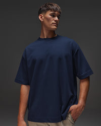 Man wearing AfterDark ZeroCrease Oversized Tee - Future Navy | Model:Jackson | Size:L | Thumbnail Index: 0
