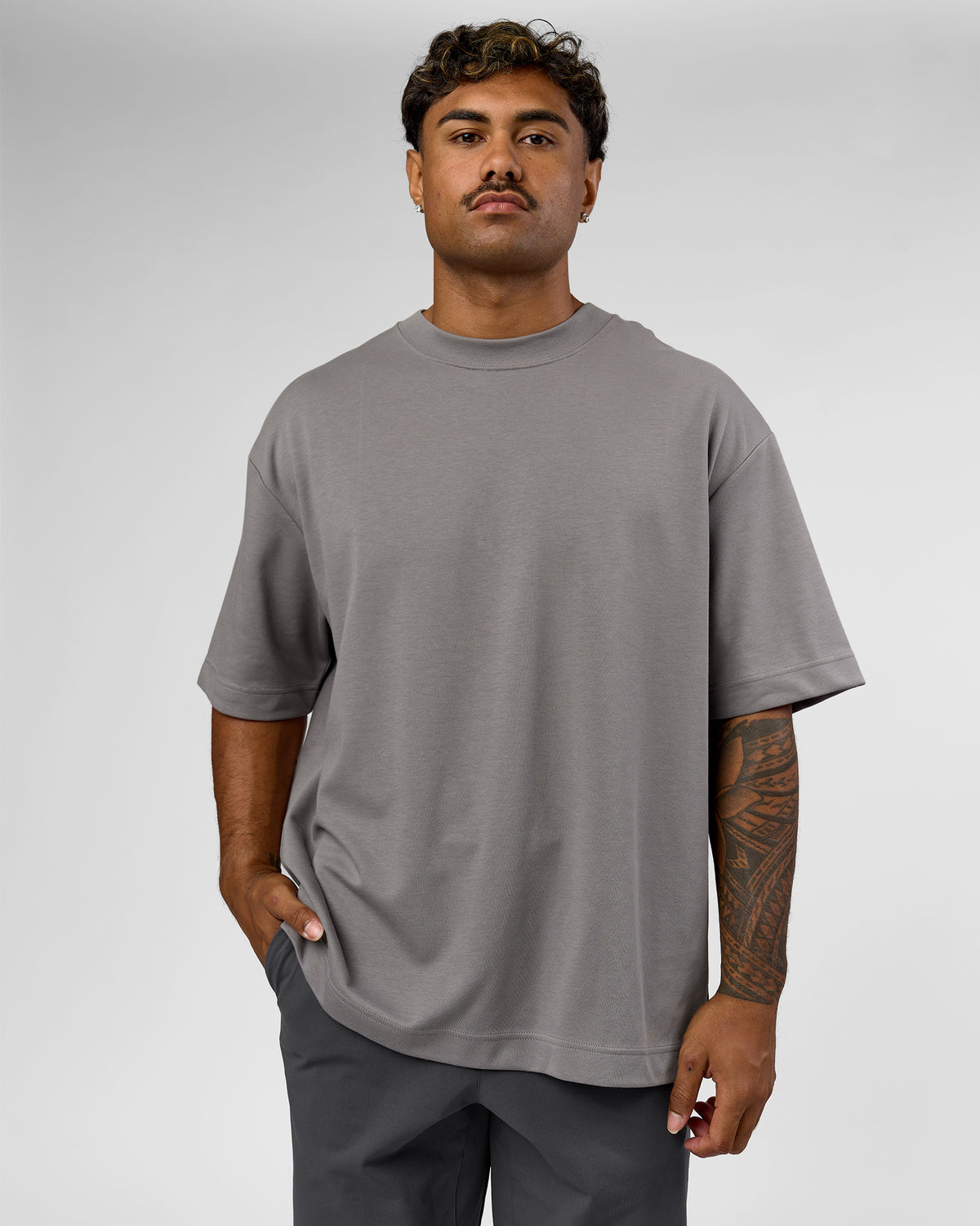 Man wearing AfterDark ZeroCrease Oversized Tee - Storm Front | Model:Xav | Size:L