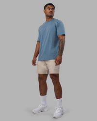 Man wearing Base FLXCotton Tee Oversized - Elemental Blue Washed | Model:Xav | Size:L | Thumbnail Index: 1