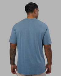 Man wearing Base FLXCotton Tee Oversized - Elemental Blue Washed | Model:Xav | Size:L | Thumbnail Index: 2