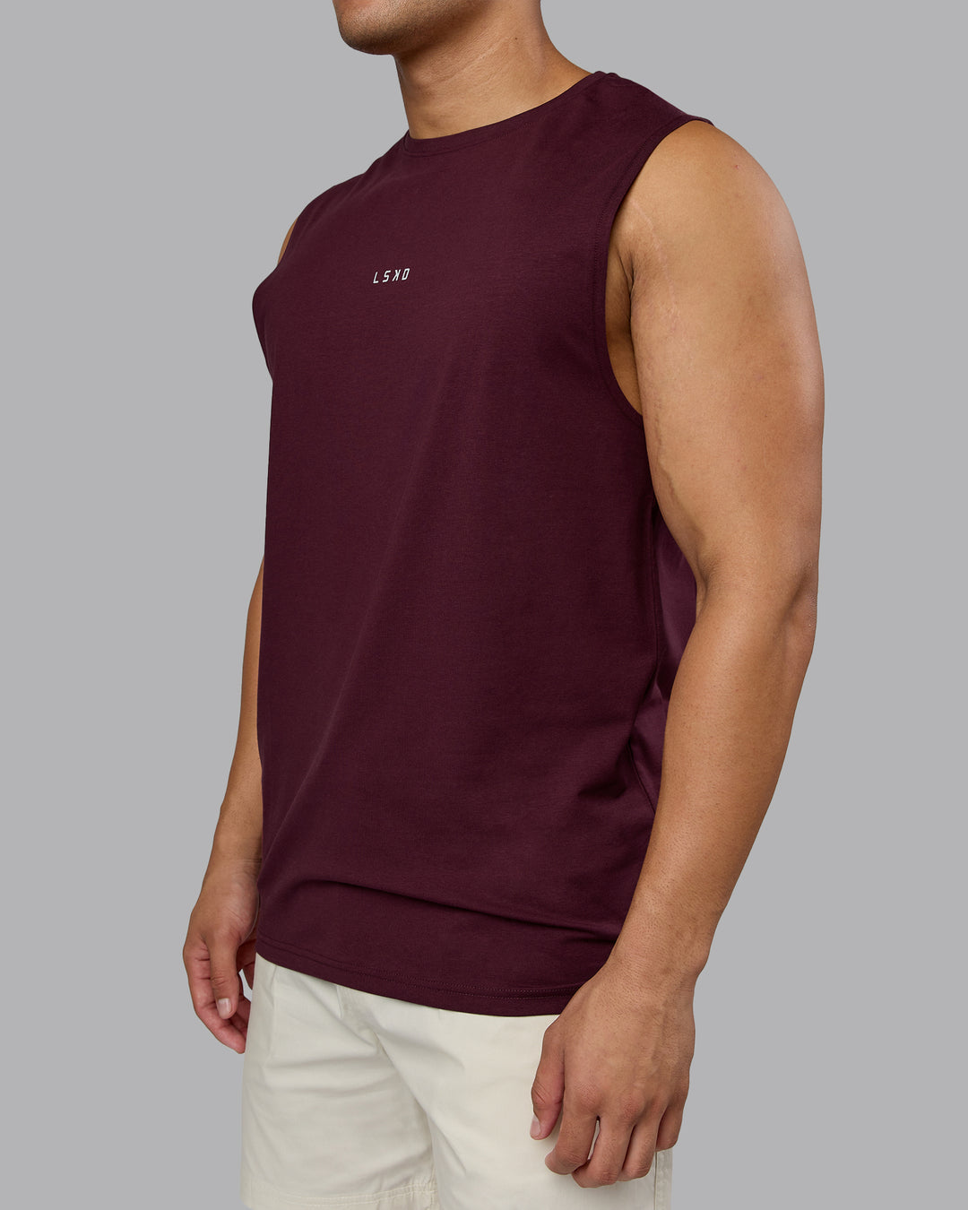 Man wearing Base FLXCotton Tank - Cherry Lacquer | Model:Kaelyb | Size:L - view 4