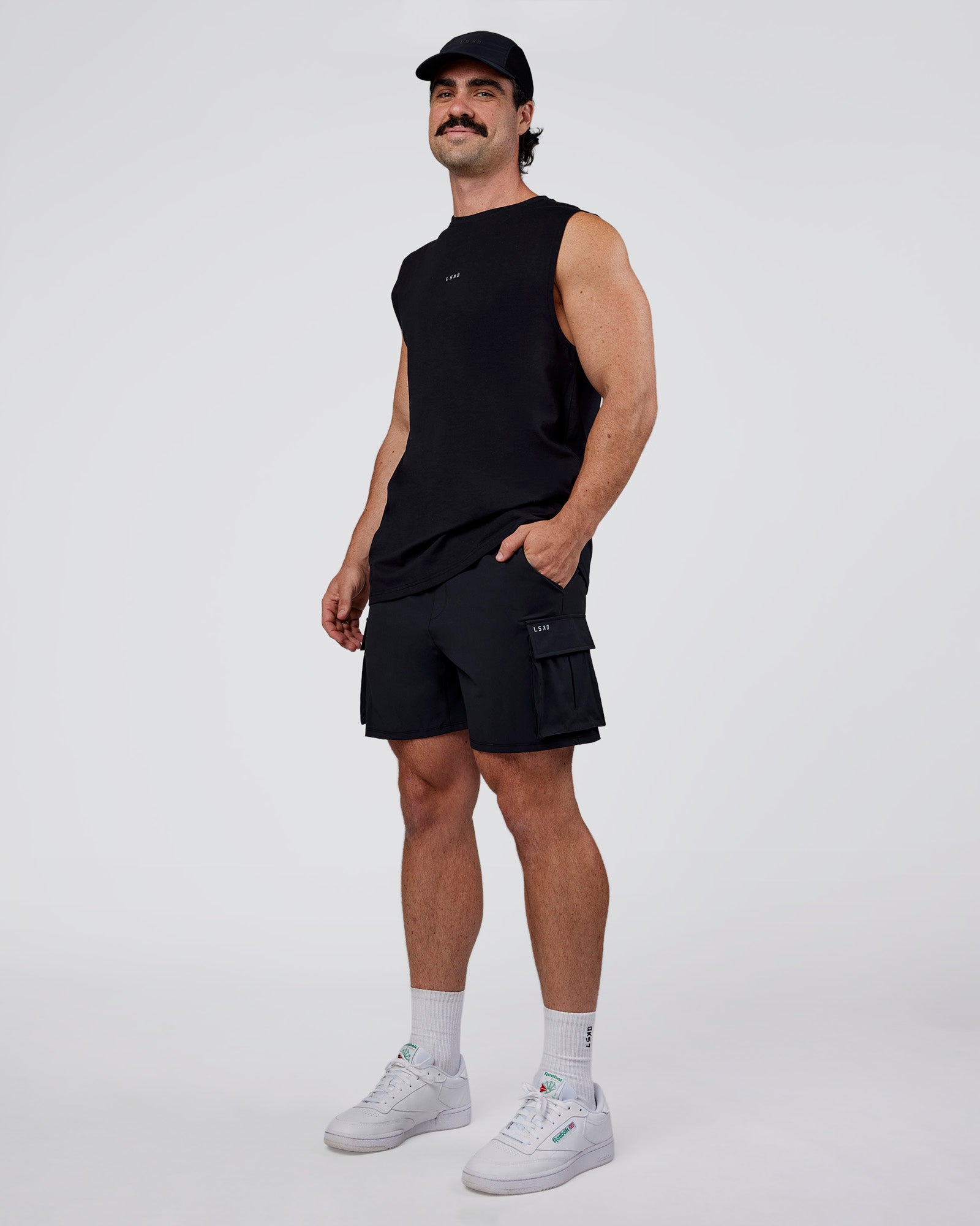 Man wearing Base FLXCotton Tank Regular Fit +2cm - Black | Model:Adam | Size:L