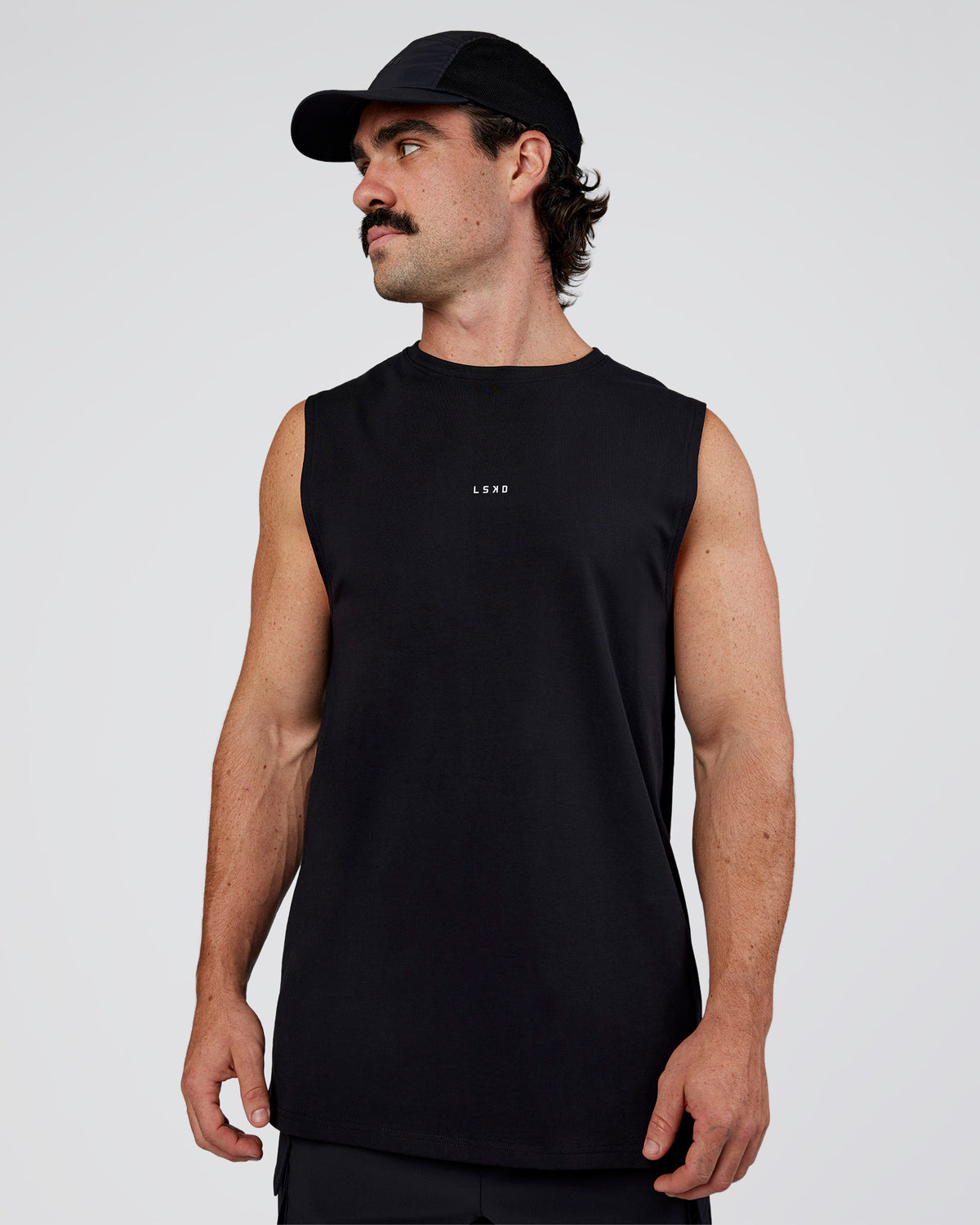 Man wearing Base FLXCotton Tank Regular Fit +2cm - Black | Model:Adam | Size:L