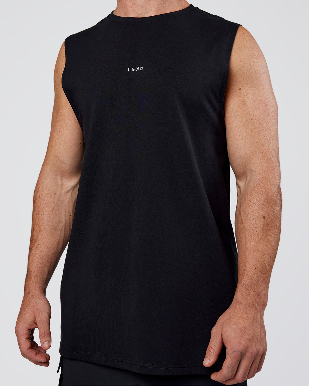 Man wearing Base FLXCotton Tank Regular Fit +2cm - Black | Model:Adam | Size:L - view 6