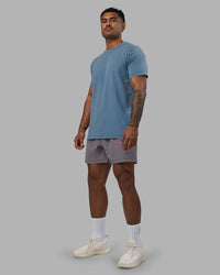 Man wearing Base FLXCotton Tee - Elemental Blue Washed | Model:Xav | Size:L | Thumbnail Index: 3