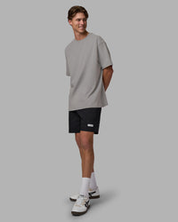 Man wearing Base FLXCotton Tee Oversized - Circular-Grey  Model:Brandon | Size:L | Thumbnail Index: 2