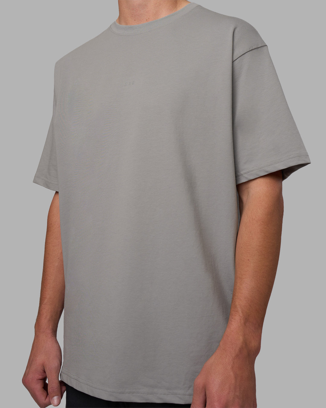 Man wearing Base FLXCotton Tee Oversized - Circular-Grey  Model:Brandon | Size:L - view 1