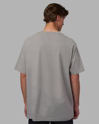 Man wearing Base FLXCotton Tee Oversized - Circular-Grey  Model:Brandon | Size:L | Thumbnail Index: 1