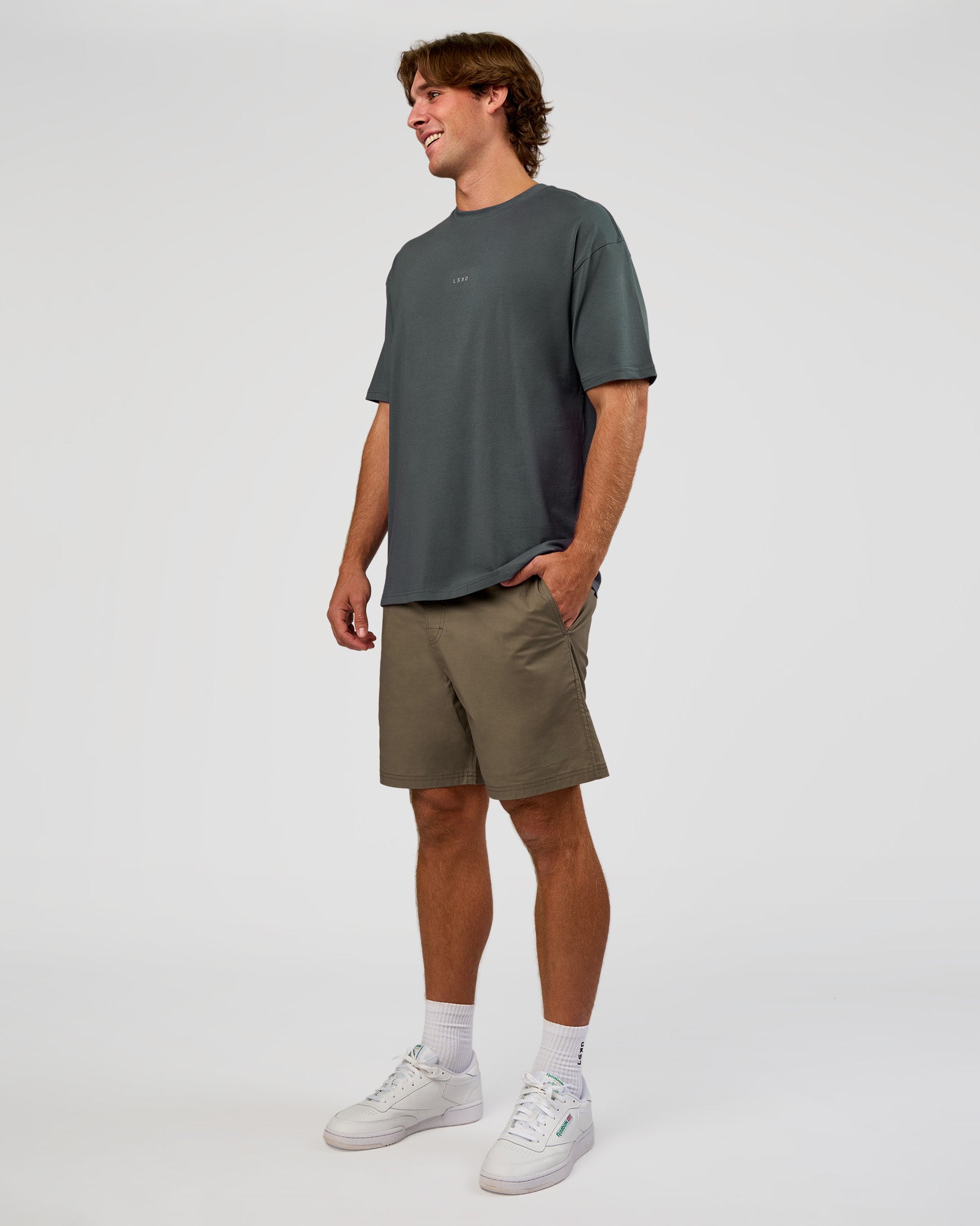 Man wearing Base FLXCotton Tee Oversized - Dark Slate | Model:Marcus | Size:L