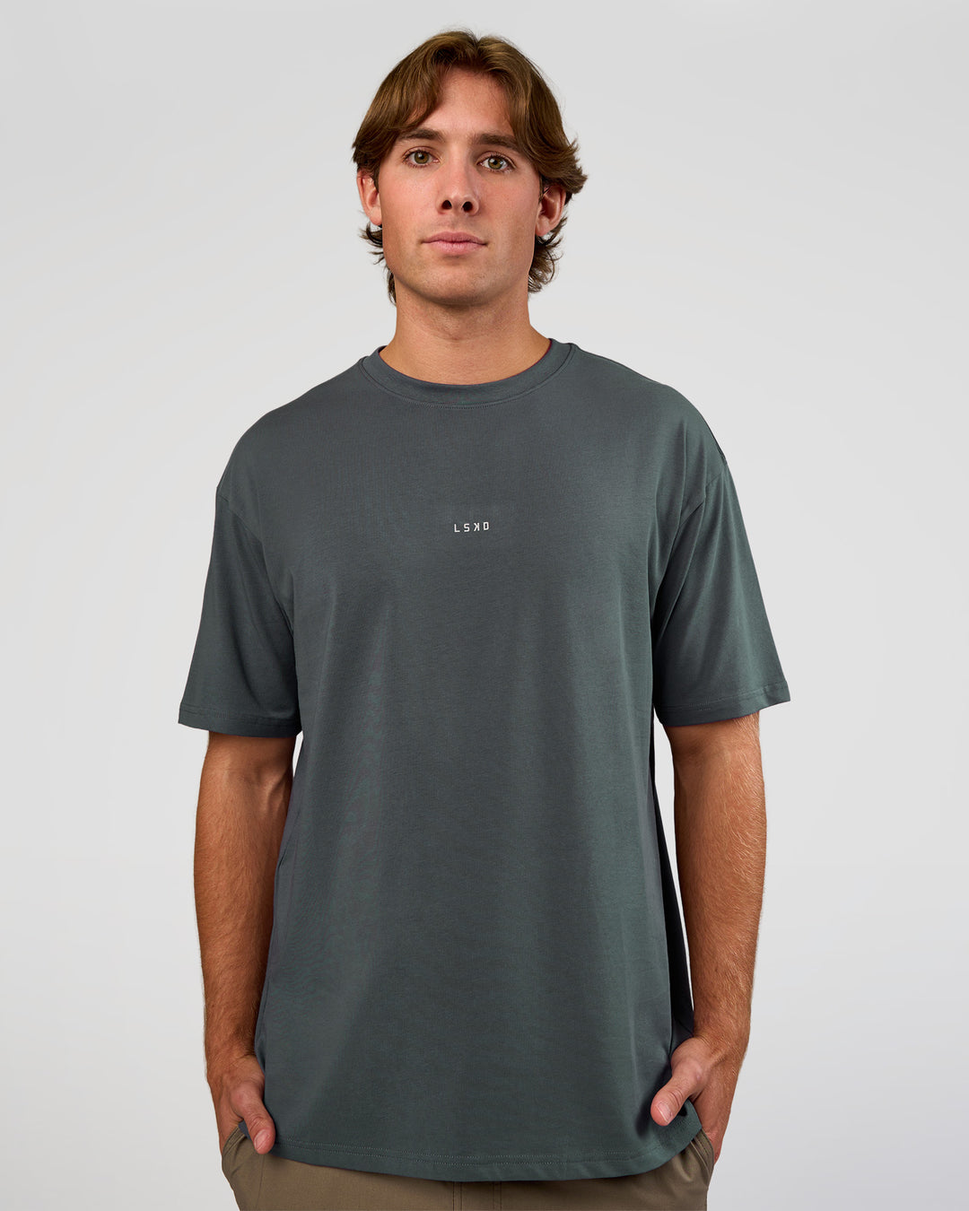 Man wearing Base FLXCotton Tee Oversized - Dark Slate | Model:Marcus | Size:L - view 1