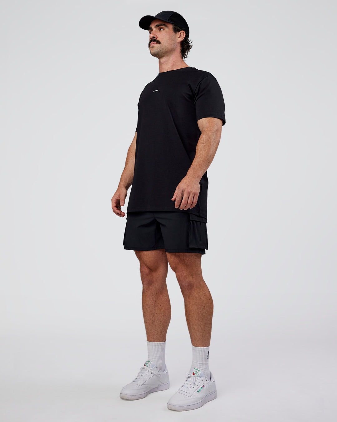 Man wearing Base FLXCotton Tee  Regular Fit +2cm - Black | Model:Adam | Size:L - view 2