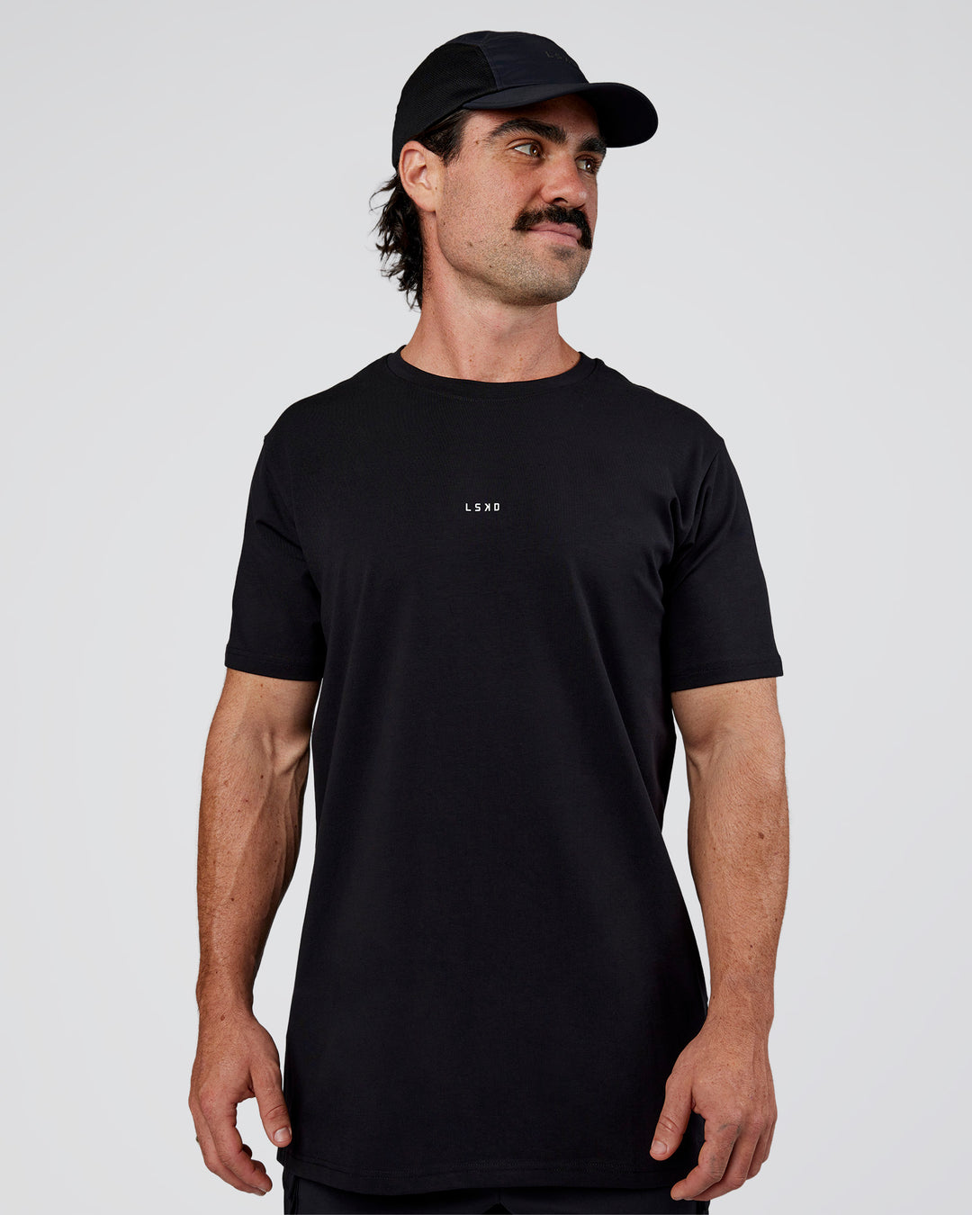 Man wearing Base FLXCotton Tee  Regular Fit +2cm - Black | Model:Adam | Size:L - view 1