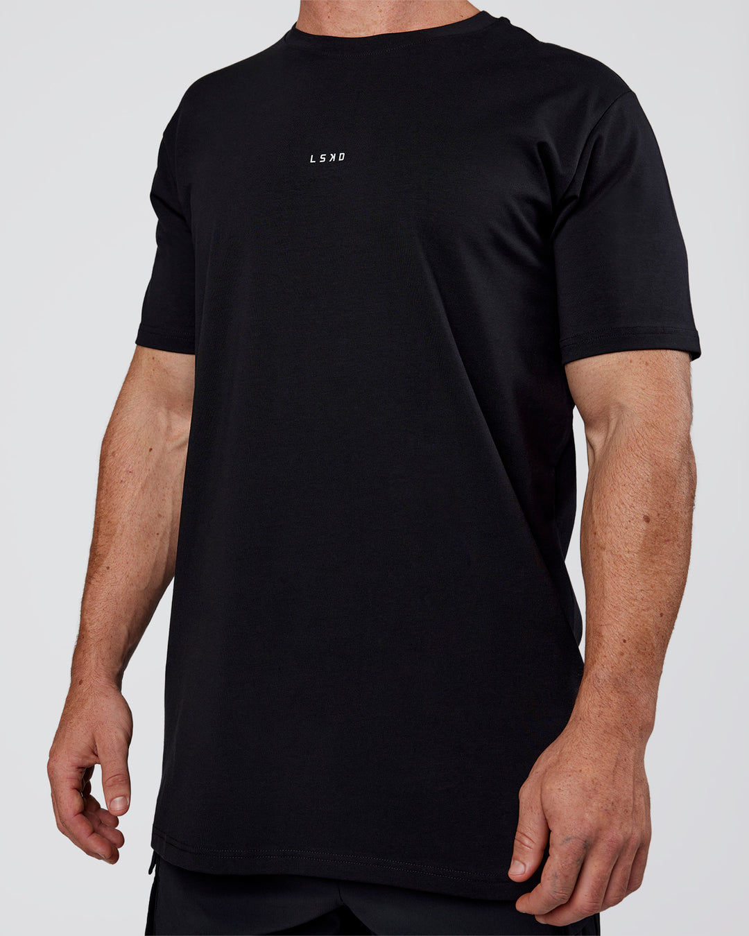 Man wearing Base FLXCotton Tee  Regular Fit +2cm - Black | Model:Adam | Size:L - view 6