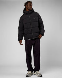 Man wearing Base Puffer Jacket - Black | Model:Okello | Size:L | Thumbnail Index: 1