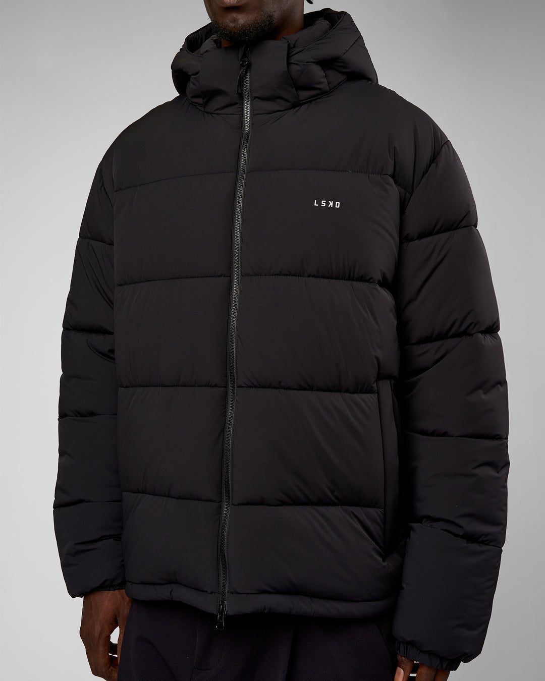 Man wearing Base Puffer Jacket - Black | Model:Okello | Size:L - view 5