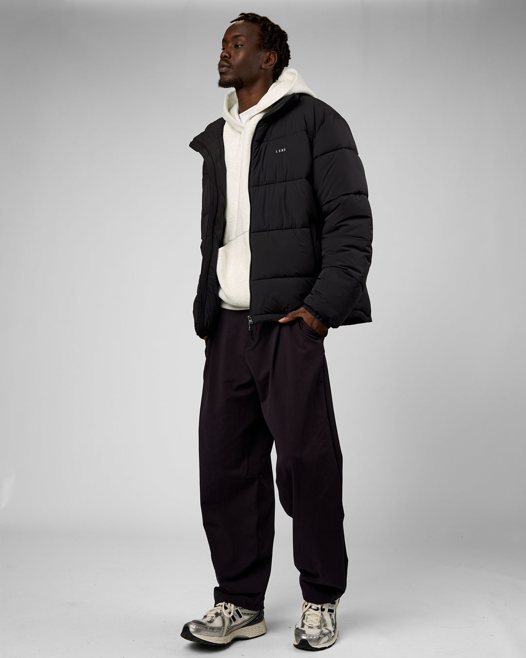 Man wearing Base Puffer Jacket - Black | Model:Okello | Size:L - view 4