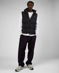 Man wearing Base Puffer Vest - Black | Model:Okello | Size:L | Thumbnail Index: 4
