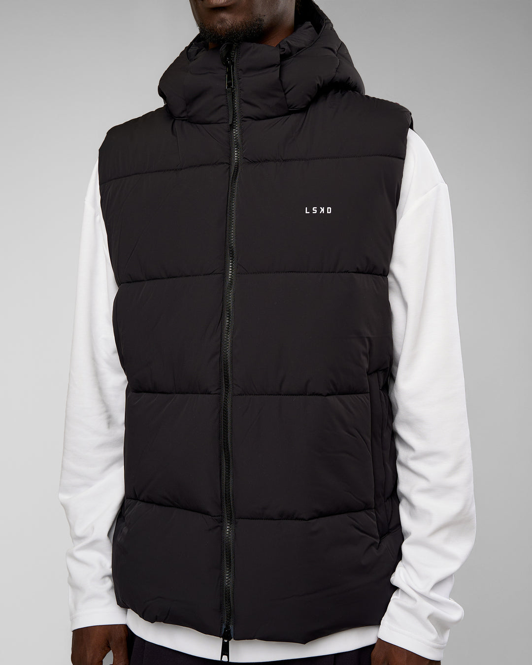 Man wearing Base Puffer Vest - Black | Model:Okello | Size:L - view 3