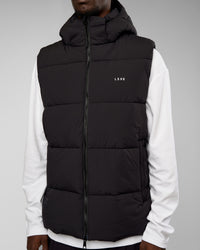 Man wearing Base Puffer Vest - Black | Model:Okello | Size:L | Thumbnail Index: 2
